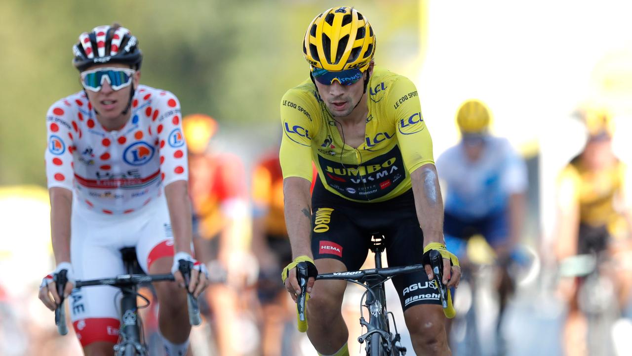 Tadej Pogacar (left) took the yellow jersey from fellow Slovenian Primoz Roglic on the final day of real racing last year, and both are favourites to win it in 2021. (Photo by STEPHANE MAHE / POOL / AFP)