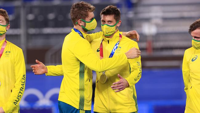 Josh Beltz puts the medal on Eddie Ockenden as Australia win the silver medal in the Hockey final between Australia and Belgium at the Oi Hockey Stadium at the 2020 Tokyo Olympics. Pics Adam Head