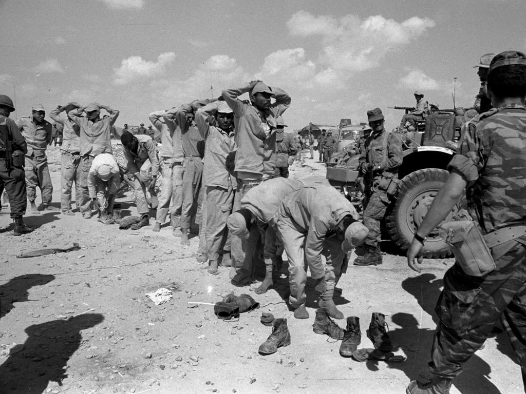 Egyptian prisoners are rounded up by Israeli troops after being captured near Al Arish in the Sinai during the Six Day War.