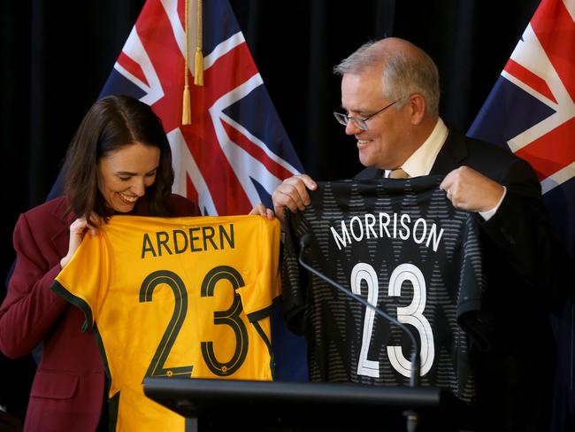 Jacinda Ardern and Scott Morrison hold women's soccer guernseys — to highlight the Women's FIFA World Cup 2023 to be hosted by Australia and New Zealand — in Queenstown on Monday. Picture: Calum Robertson