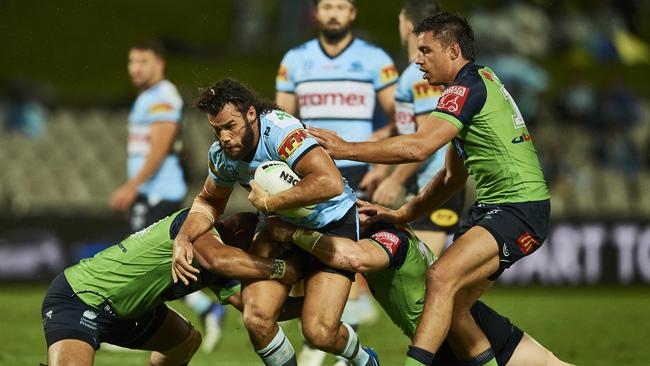 SYDNEY, AUSTRALIA – MARCH 21: Toby Rudolf of the Sharks is tackled during the round two NRL match between the Cronulla Sharks and the Canberra Raiders at Netstrata Jubilee Stadium, on March 21, 2021, in Sydney, Australia. (Photo by Brett Hemmings/Getty Images)