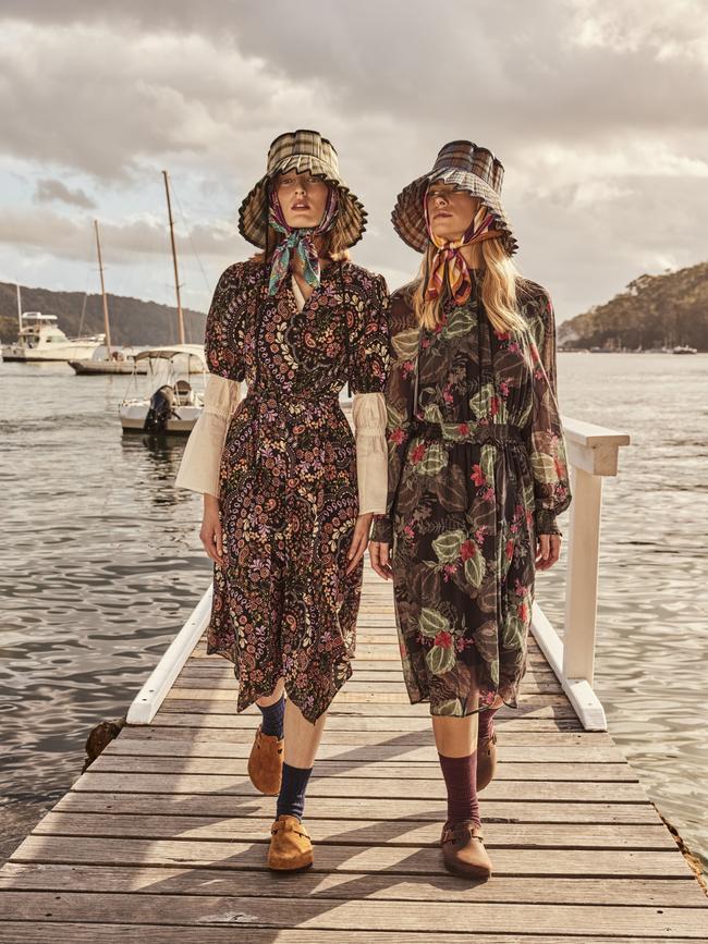 (from left) Emily wears Harris Scarfe Stella Winter Paisley asymmetric dress and JB Jayson Brunsdon flared sleeve shirt in White (worn underneath), harrisscarfe.com.au; Lorna Murray hat, lornamurray.com.au; Zara scarf, zara.com/au; UNIQLO socks, uniqlo.com; Birkenstock shoes, birkenstock.com.au Siânie wears Harris Scarfe JB Jayson Brunsdon shirred waist dress in Shadow, <a href="https://www.harrisscarfe.com.au/">harrisscarfe.com.au</a>; Lorna Murray hat, Zara scarf, UNIQLO socks and Birkenstock shoes, as before. Photography: Steven Chee