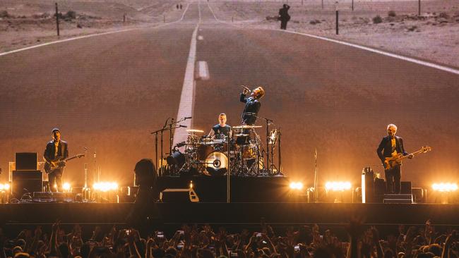 U2 perform on the Joshua Tree tour.