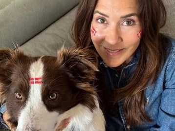 The picture of Princess Mary turned right-side-up, showing she and her dog adorned with Danish flags.