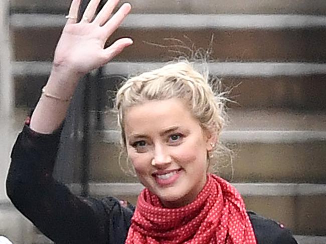 US actress Amber Heard waves as she leaves at the end of the seventh day of the libel trial by her former husband US actor Johnny Depp. Picture: AFP