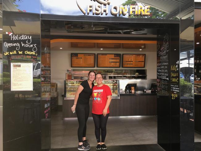 Fish On Fire owner Flora Cai (r), with employee Georgia Burnett, said the elderly have been great customers although there are fewer frequenting the shopping strip of late. Picture: Darren Cartwright