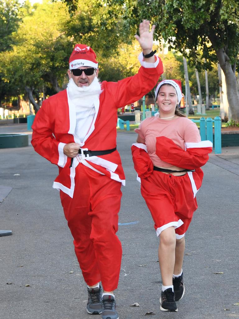 Osmar Luiz and Ana Clara at the Darwin Santa Fun Run in July at Mindil Beach. Picture Katrina Bridgeford