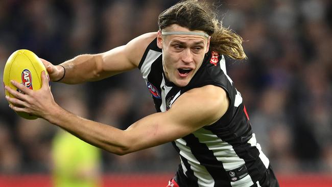 Darcy Moore overcame illness to deliver a strong performance down back. Picture: Quinn Rooney/Getty Images