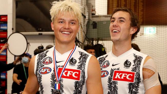 Jack Ginnivan celebrates with teammate Callum Brown after Collingwood won the Anzac Day match. Picture: Dylan Burns