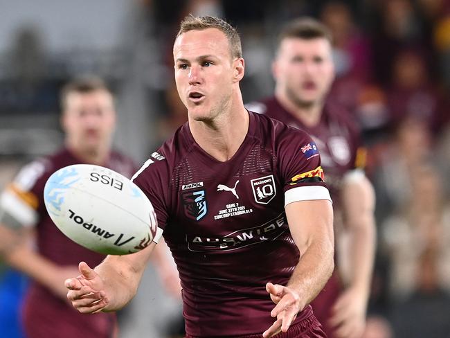 BRISBANE, AUSTRALIA - JUNE 27: Daly Cherry-Evans of the Maroons offloads the ball during game two of the 2021 State of Origin series between the Queensland Maroons and the New South Wales Blues at Suncorp Stadium on June 27, 2021 in Brisbane, Australia. (Photo by Bradley Kanaris/Getty Images)