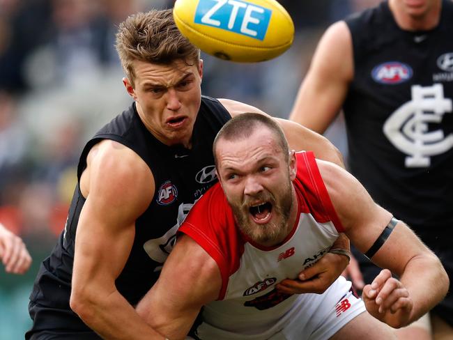 Patrick Cripps brings down Max Gawn.