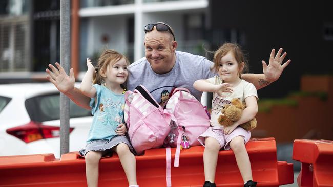 David Clinckers, who was yesterday picking up his with twins Bella and Tess, 4, from their kindy on the other side of the border, will be glad when the border is fully reopened. Picture: Nigel Hallett