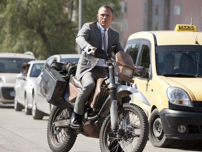 Daniel Craig as James Bond riding a Honda CRF250R in Skyfall