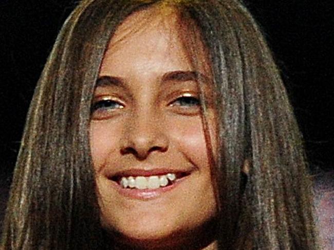 Michael Jackson's children, Prince Jackson (L), Blanket Jackson (C) and Paris Jackson (R) speak on stage during the 'Michael Forever' concert in memory of the late Michael Jackson at The Millenium Stadium in Cardiff, Wales on October 8, 2011. AFP PHOTO / LEON NEAL