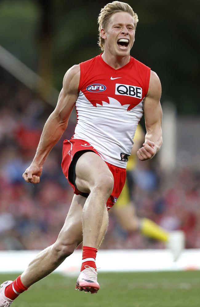 Isaac Heeney guided the Swans over the Cats.