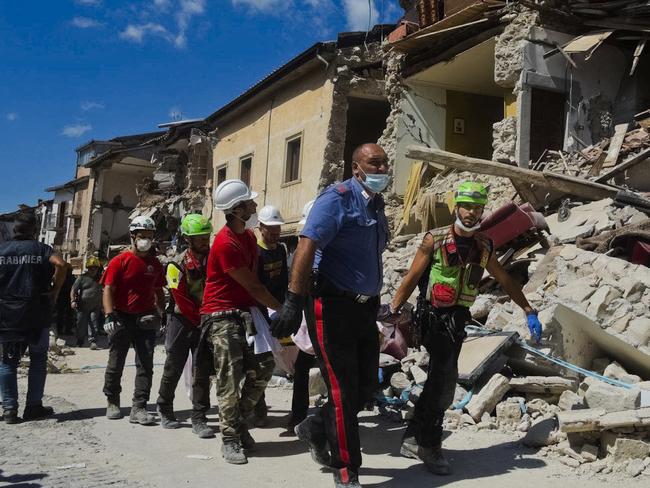 A victim is taken away in Amatrice, central Italy. Picture: AP