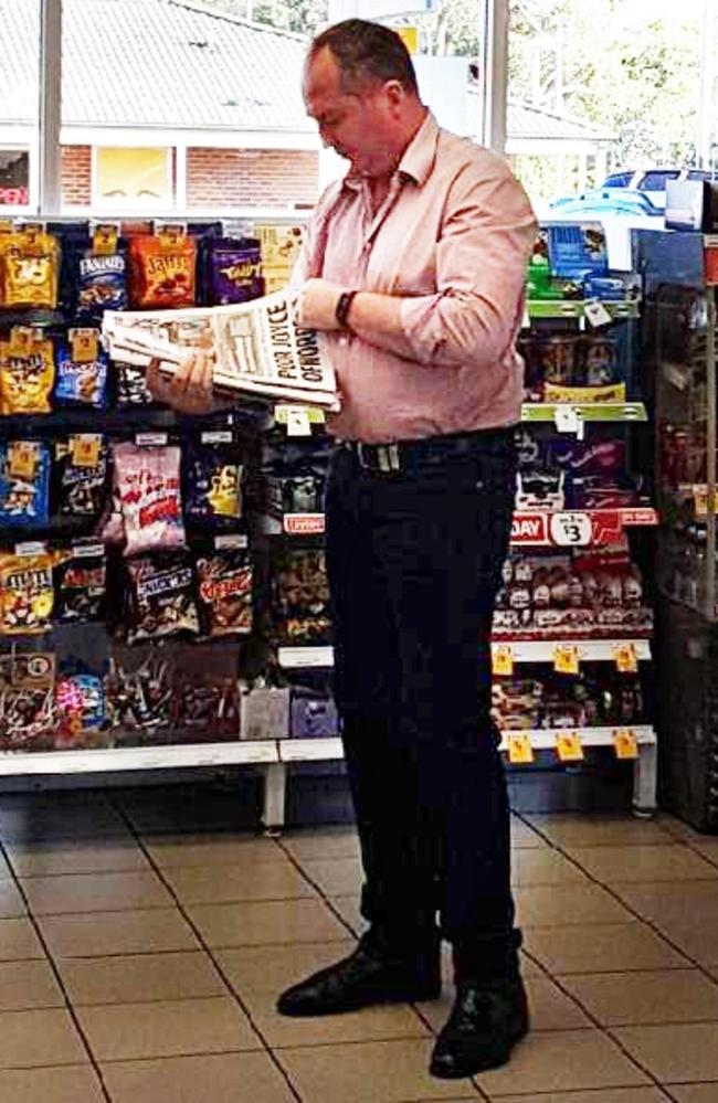 Barnaby Joyce reading The Saturday Telegraph earlier today at a petrol station in Goulburn. Picture: Supplied