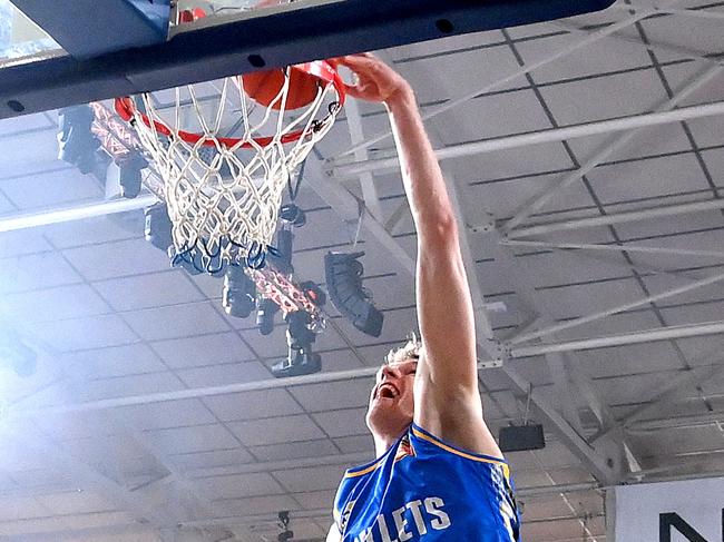 Rocco Zikarsky slam dunks during the warm up before the round five NBL match between Brisbane Bullets and Tasmania Jackjumpers at Nissan Arena. Photo: Bradley Kanaris/Getty Images.