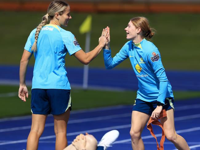 Matildas pair Courtney Nevin (left) and Cortnee Vine acknowledge each other at training. Picture: Adam Head