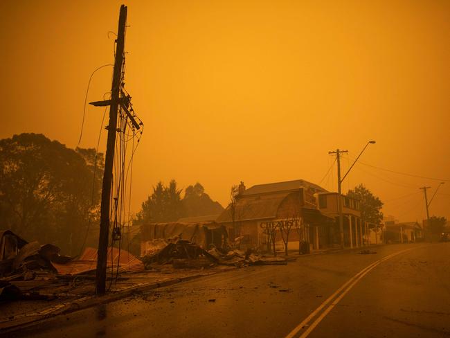 The remains of burnt-out buildings along the main street in Cobargo on December 31, 2019. Picture: Sean Davey / AFP