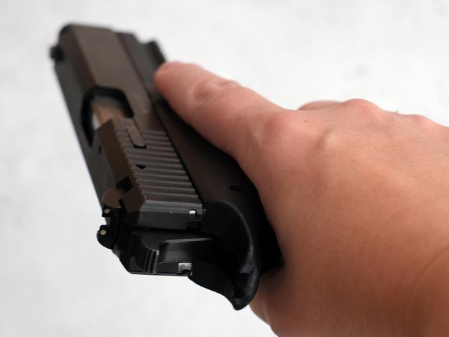 File image of a 9mm Glock in a woman's hand. iStock.