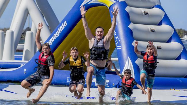 Zane Platt, 12, Bodhi Pryer, 12, Matt Pryer, Nate Pryer, 5, and Adyn Pryer, 10, at the GC Aqua Park, Southport. Picture: Jerad Williams