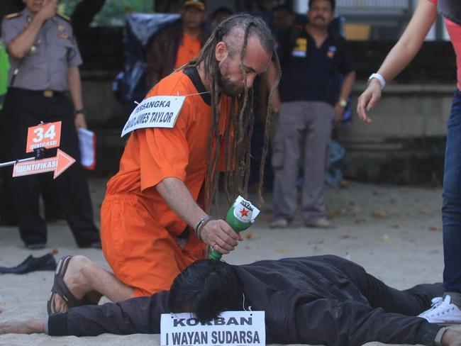 Sara Connor and David Taylor take part in a police re-enactment on Kuta beach on August 31 Picture: Zul Eduardo