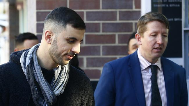 L to R: Imad Ghanem heads into Burwood Court accompanied by Lawyer Pawel Kulisiewicz. Picture: John Appleyard