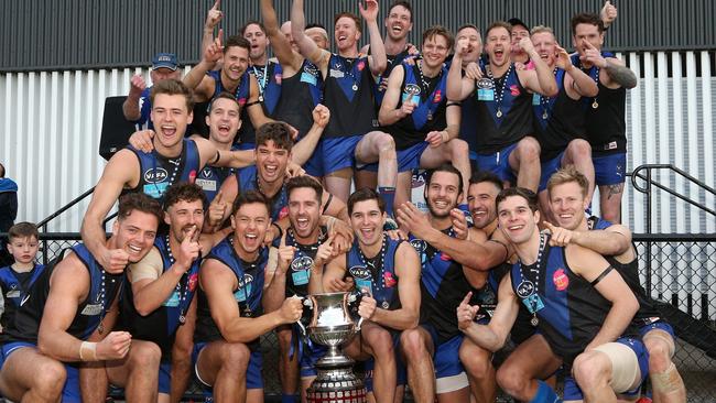 Uni Blues celebrate their 2019 premiership after knocking off St Kevin's in the decider. Picture: Hamish Blair