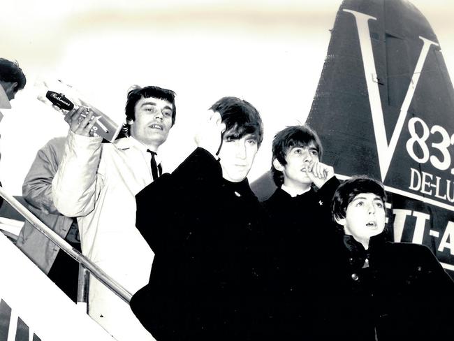 The Beatles land in Australia in 1964 for a tour. Picture: News Corp