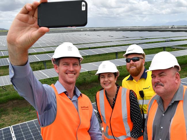 Minister for Main Roads, Road Safety and Ports and Minister for Energy, Biofuels and Water Supply, Mark Bailey (left), Queensland Premier Annastacia Palaszczuk (2nd from left), Wayne Staunton (2nd from right), Project Manager and the ALP candidate for Burdekin, Mike Brunker (right) are seen taking a selfie while inspecting the Clare Solar Farm project near the North Queensland town of Ayr during the Queensland Election campaign on Sunday, November 12, 2017. Premier Palaszczuk announced if re-elected her government would commit $151.6 million to the expansion of large scale renewable energy generation. (AAP Image / Darren England) NO ARCHIVING