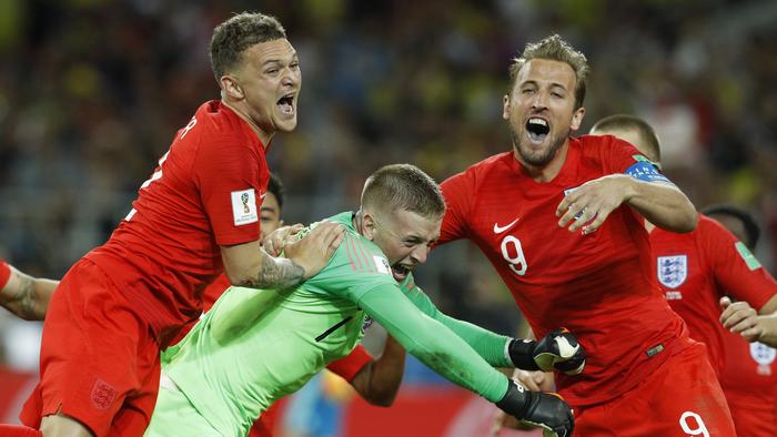 England's Harry Kane, right, goalkeeper Jordan Pickford, centre, and Kieran Trippier celebrate. (AP Photo/Victor R. Caivano)