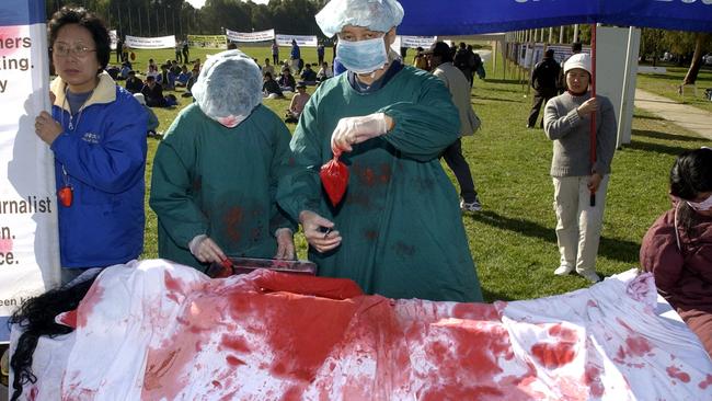 Falun Gong members protest in Canberra about organ harvesting in China.