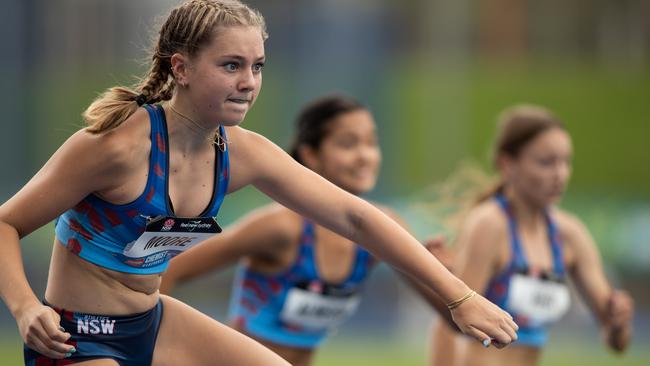 Jordan Moore from Caringbah South takes the gold in her hurdles..