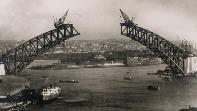 The Harbour Bridge under construction in 1930. Picture: State Library of New South Wales.