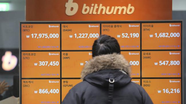 A man watches a screen showing the prices of bitcoin at a virtual currency exchange office in Seoul, South Korea on Tuesday, January 16. Picture: Ahn Young-joon/AP