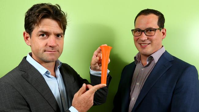 Plastic and Reconstructive surgeon Dr Michael Wagels and orthopaedic surgeon Dr Martin Lowe with a copy of the 3D printed implant used to replace 12.5cm of Asha Morris's left tibia. Photo: David Clark.