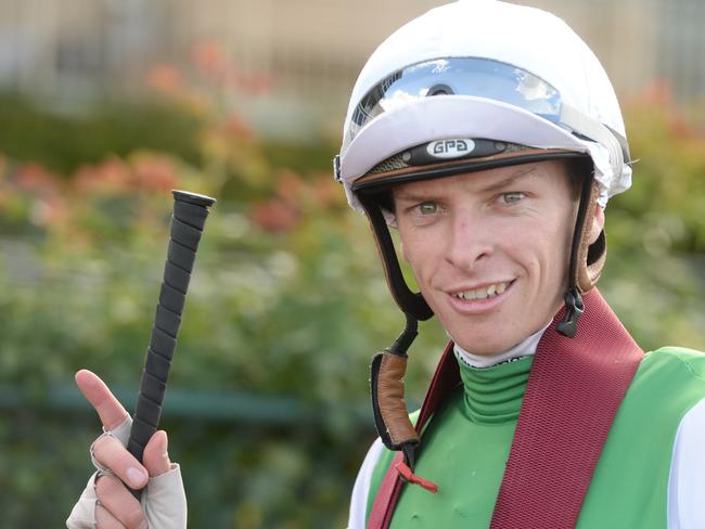 Michael Dee returns to scale after his winning ride on Hellova Street.