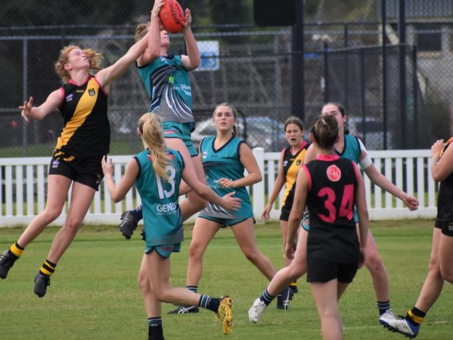 April Devine takes a strong mark for the Coffs Breakers in the match against Grafton. Photo: Green Shoots Marketing