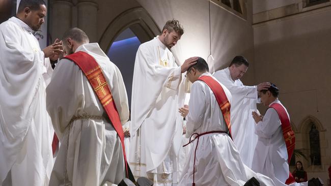 Twenty centuries of Catholic pomp and mystique are on show at St Stephen’s ordination. Picture: Natalie Grono