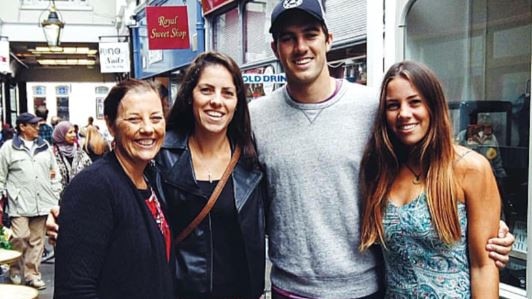 Pat Cummins alongside mother Maria (left) and sisters Kara and Laura.