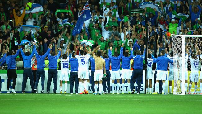 MELBOURNE, AUSTRALIA - JANUARY 18: Uzbekistan players and officials celebrate after they defeated Saudi Arabia during the 2015 Asian Cup match between Uzbekistan and Saudi Arabia at AAMI Park on January 18, 2015 in Melbourne, Australia. (Photo by Robert Cianflone/Getty Images)