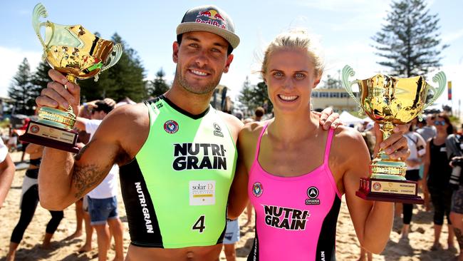 Matt Poole and Harriet Brown show off their silverware after winning the 2017 Nutri-Grain Ironman and Ironwoman series at North Cronulla Beach. Picture: Gregg Porteous