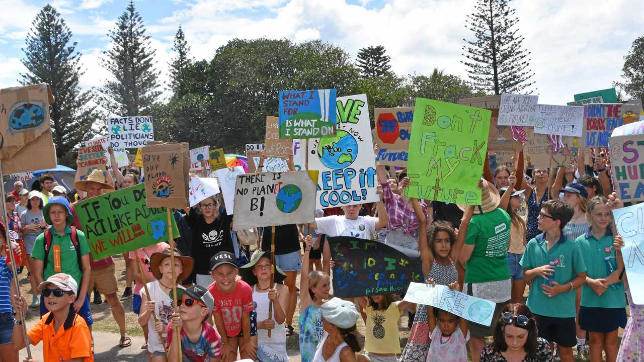 Young protesters at Peregian Beach made their message loud to stand up against climate change. Picture: Caitlin Zerafa