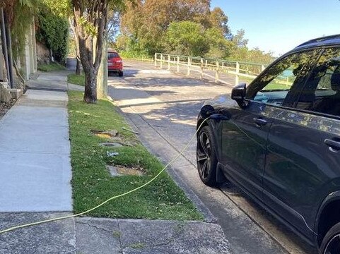 Another EV cord running across a footpath in Mosman.