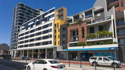 An artist's impression of a 9-storey boarding house development (in yellow) on Pittwater Rd in the Dee Why CBD which some objectors reckon will set a precedent for the “visual murder” of Dee Why. Picture: Crawford Architects