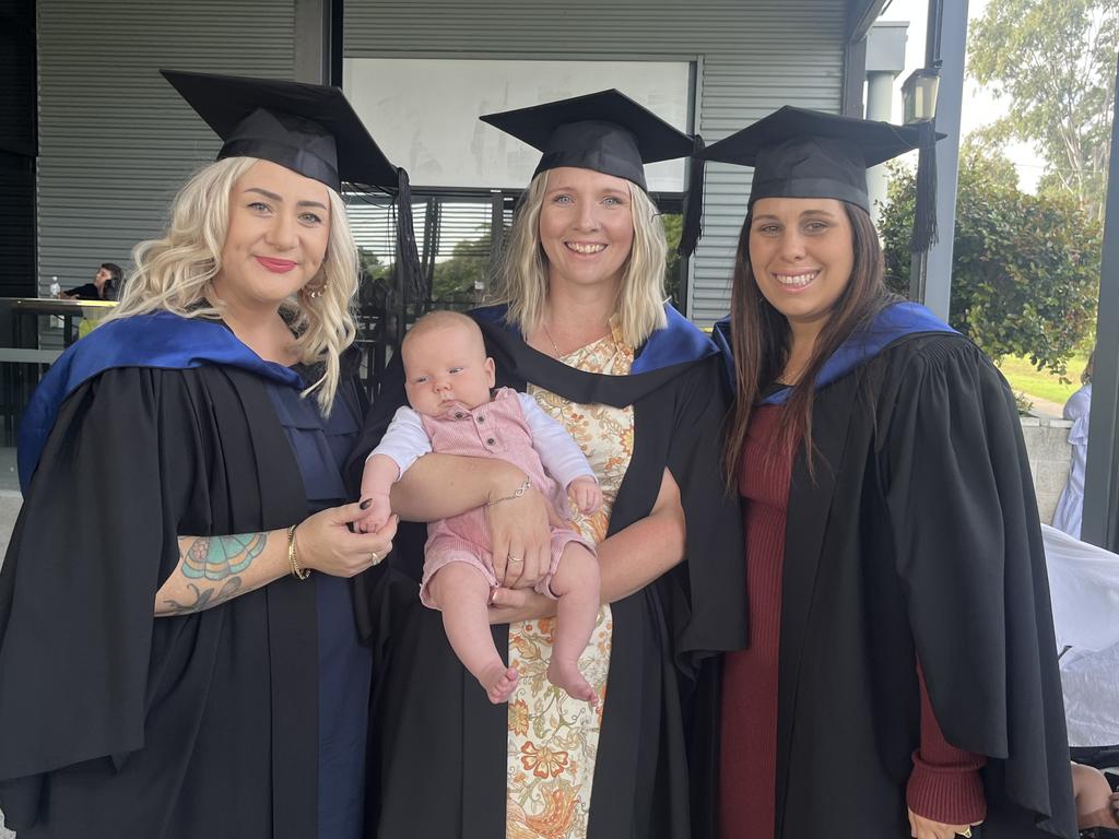 Graduates from the University of the Sunshine Coast's Fraser Coast campus celebrating at the Brolga Theatre.