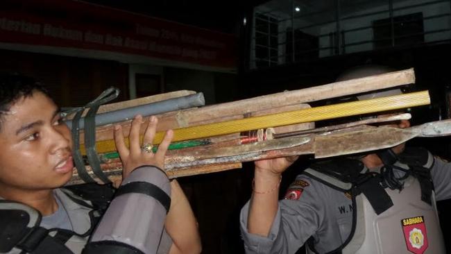 Raids ... Police bring out weapons seized inside bali's Kerobokan jail. Picture: Supplied