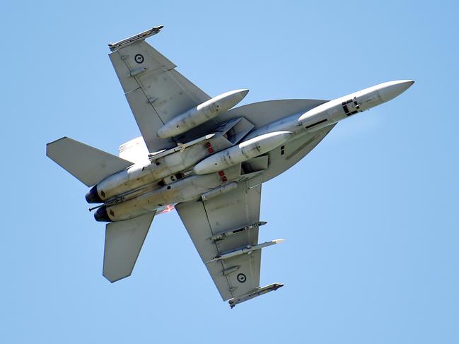 Two F/A-18E/F Super Hornets fly pass over Magnetic Island and The Strand, Townsville. Picture: Alix Sweeney