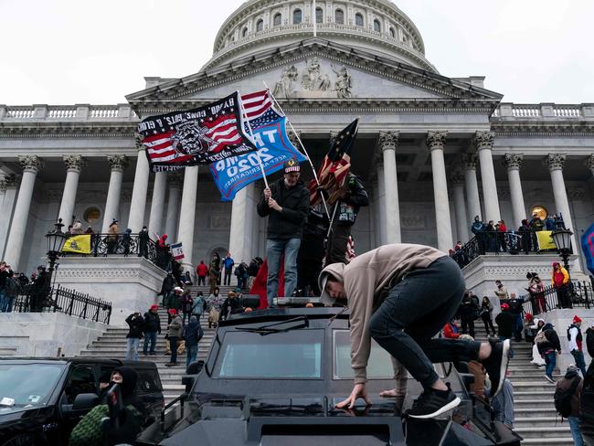 (FILES) In this file photo taken on January 06, 2021 Supporters of US President Donald Trump protest outside the US Capitol in Washington, DC. - One year after his first impeachment, former president Donald Trump finds himself the subject of an unprecedented second trial beginning Tuesday in the Senate, whose members must determine whether he incited a deadly assault on the US Capitol. The 100 senators will also step into controversial, uncharted territory when they sit in judgment of a president who is no longer in office, a deeply damaged political figure who remains a potent force in his party even without the power of the White House. (Photo by ALEX EDELMAN / AFP)